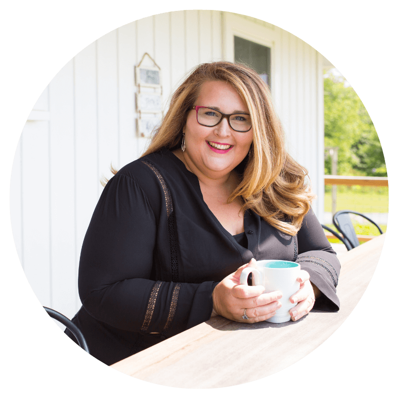 Holly Cain circle headshot (1) Holly Cain holding a mug